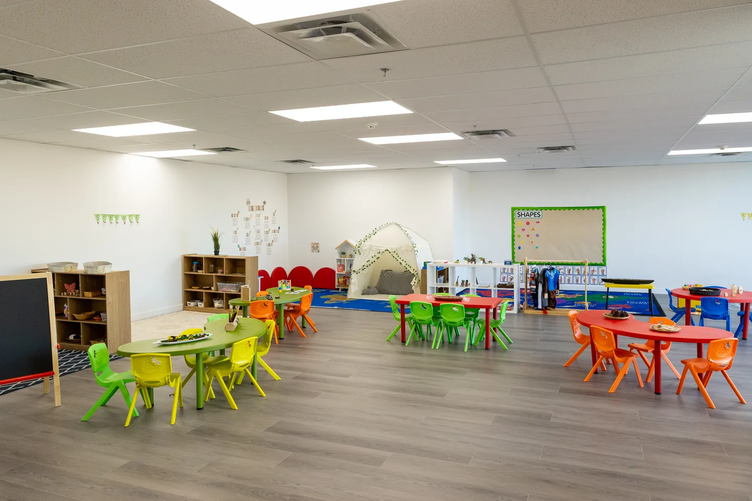 A bright activity room with tables